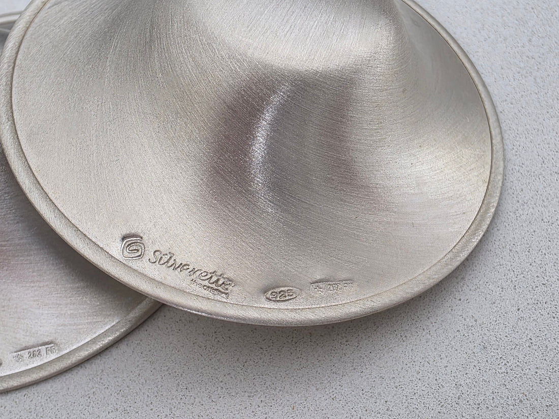 Close-up of the Silverette logo and 925 silver hallmark stamped on the rim of a genuine Silverette nursing cup