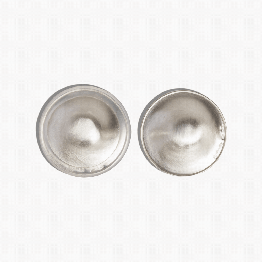 Pair of Silverette 925 sterling silver nursing cups showing the smooth inner surface