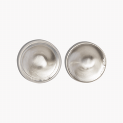 Pair of Silverette 925 sterling silver nursing cups showing the smooth inner surface